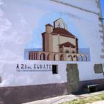 an einer Hauswand in Muruzábal Wegweiser zur Ermita Santa Maria de Eunate