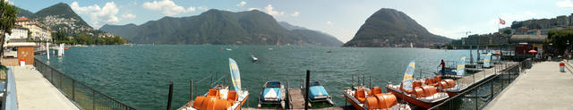 Breitbildfoto Hafen in Lugano mit Monte Brè, Monte Generoso und San Salvatore